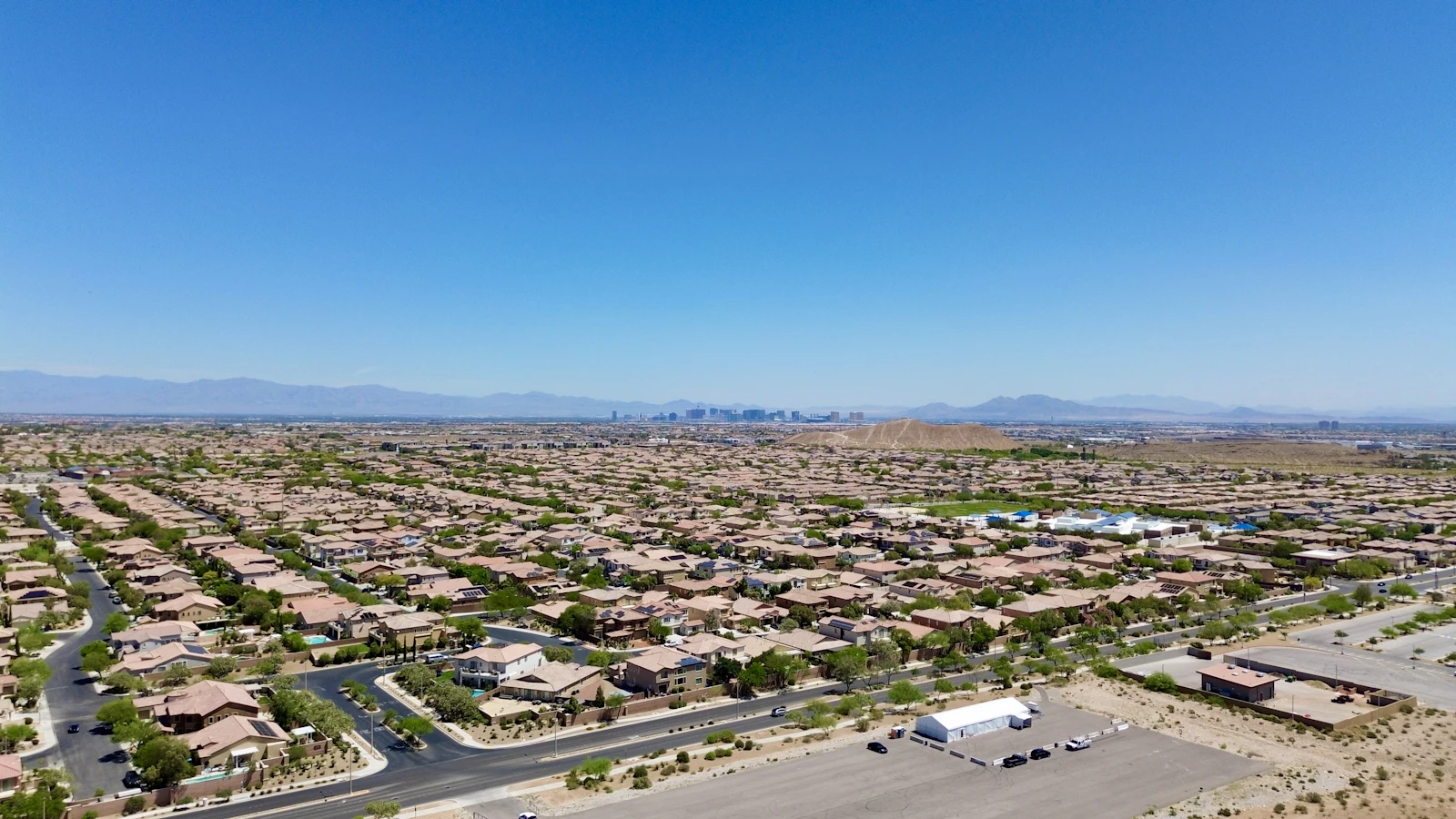 Aerial view of suburban Las Vegas homes with mountains in the distance