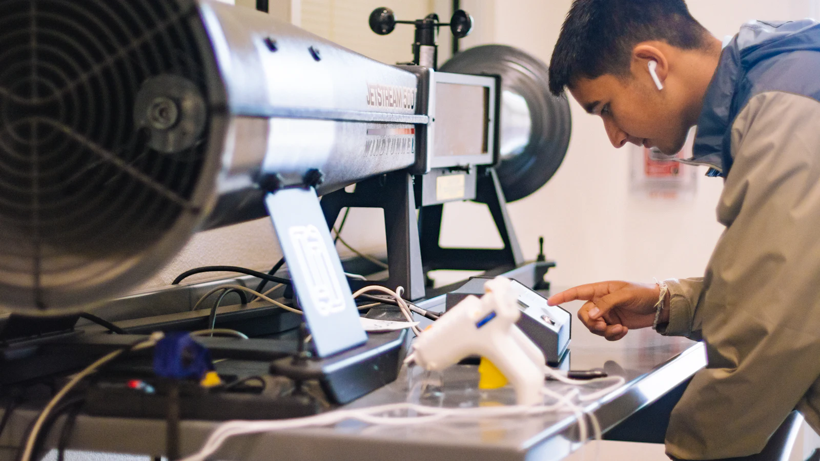 Technician working on equipment at a workbench