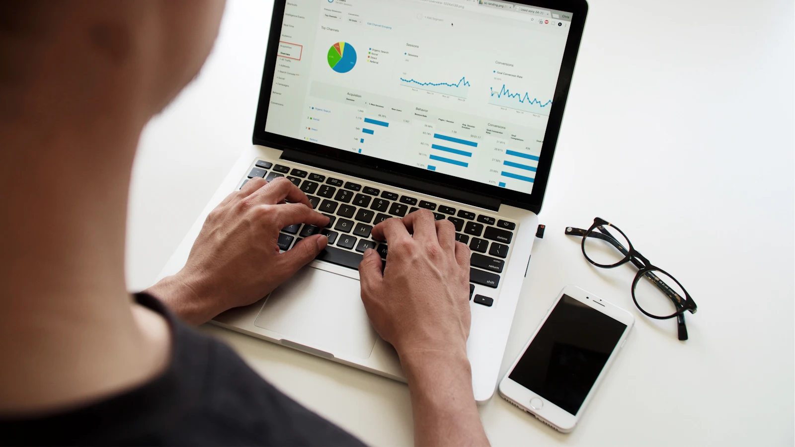 Person reviewing performance charts on a laptop