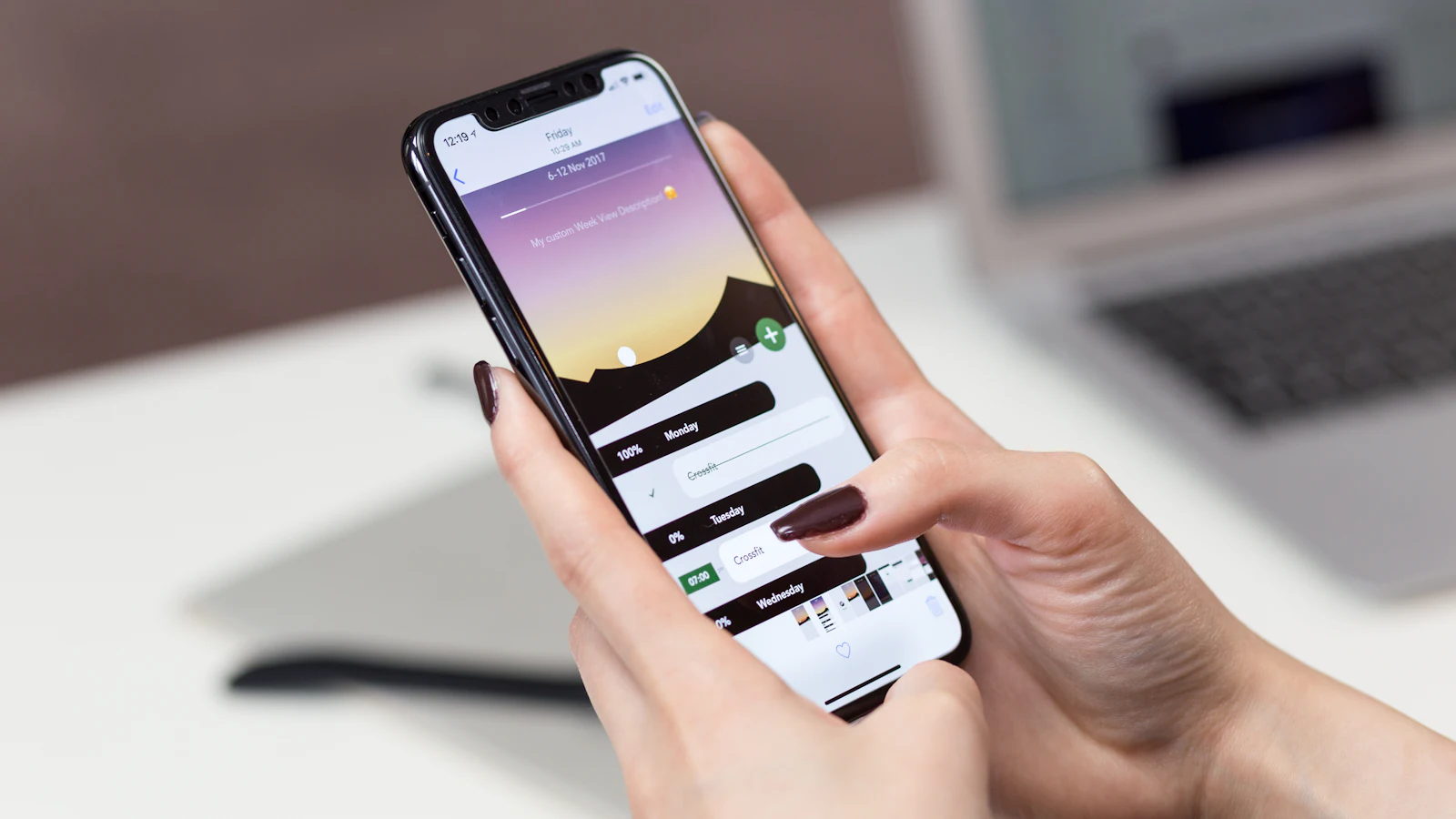 Hand holding a smartphone browsing a website